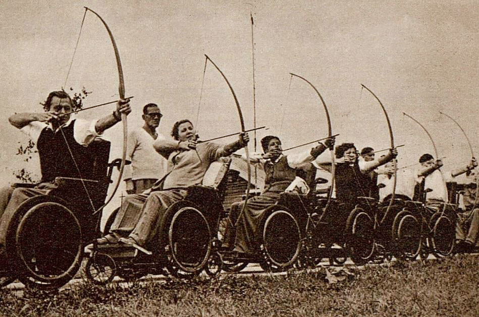 Wheelchair athletes competing in archery at the 1948 Stoke Mandeville Games. Paralympic Games history: Wheelchair athletes competing in archery at the 1948 Stoke Mandeville Games.
