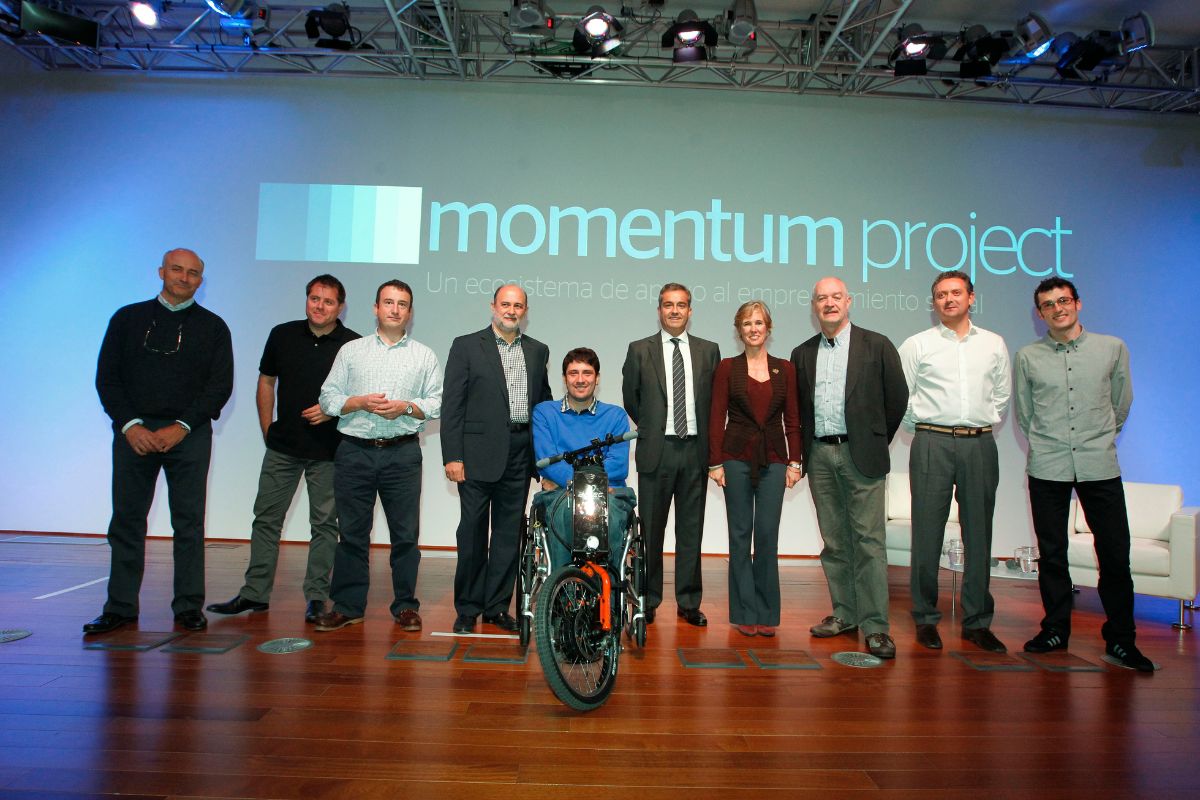 A man with a wheelchair and an electric handbike by Batec Mobility